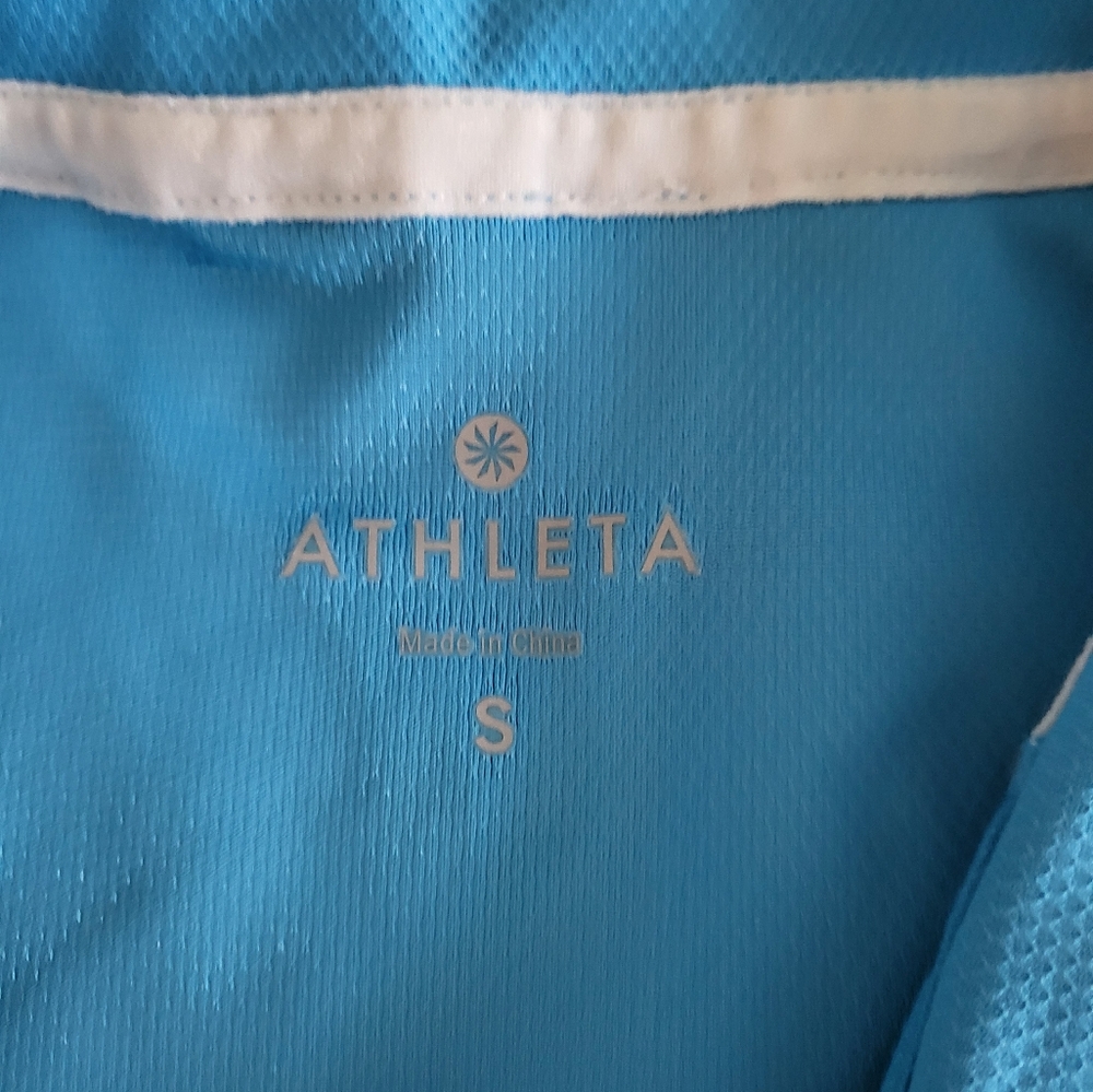 Size SM, Athleta, turquoise golf or tennis top with shirred sides.